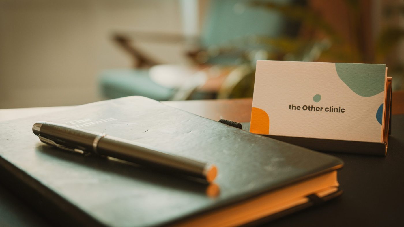 the other clinic pen and logo
