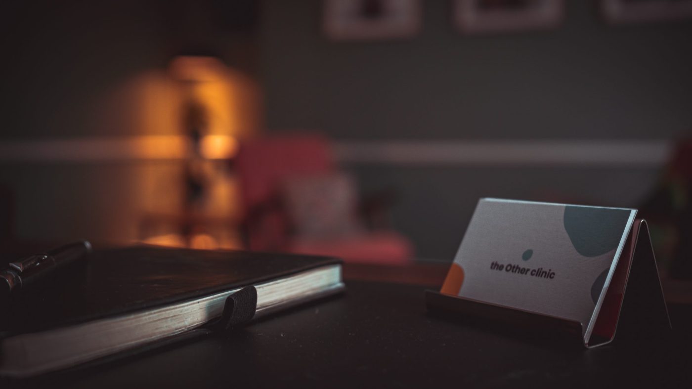 notebook and calling card the other clinic
